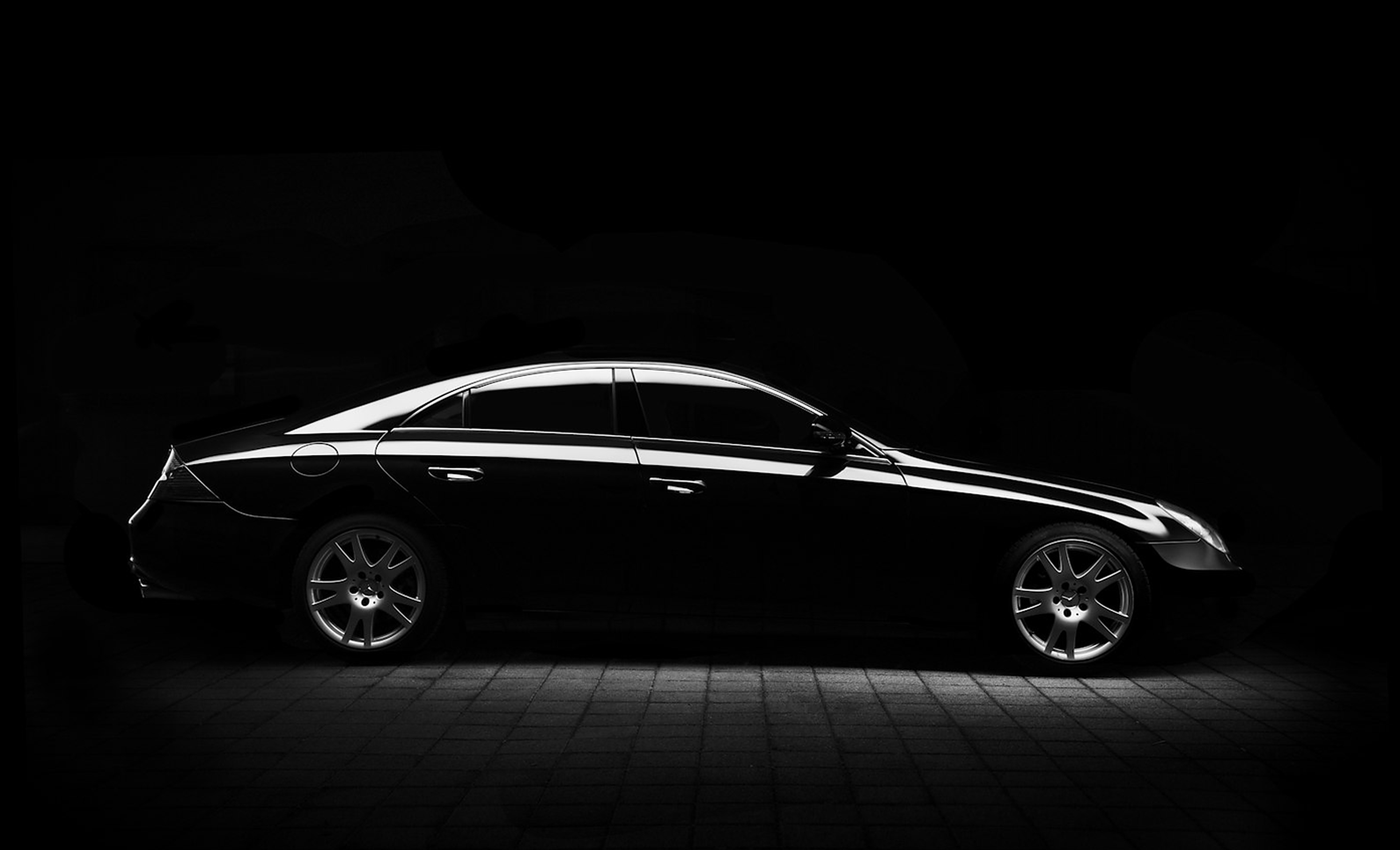 Luxury car in a dark studio